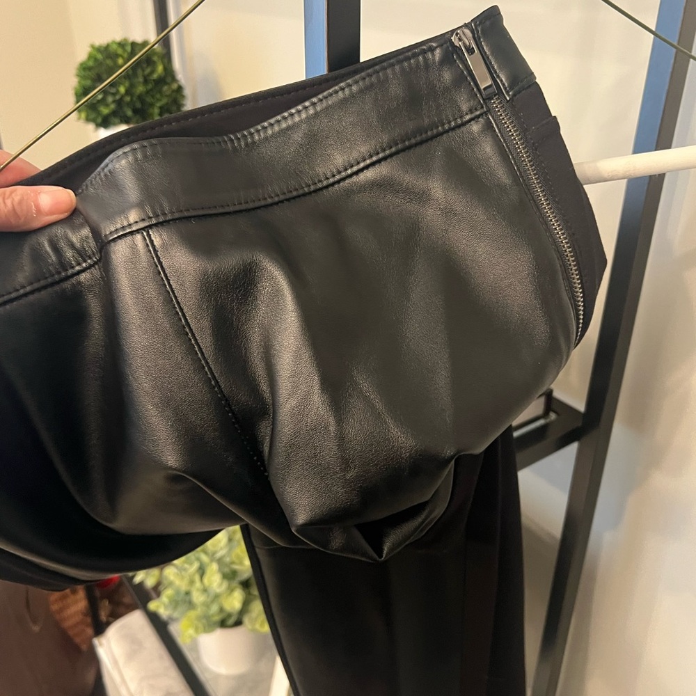Black faux leather and knit pants